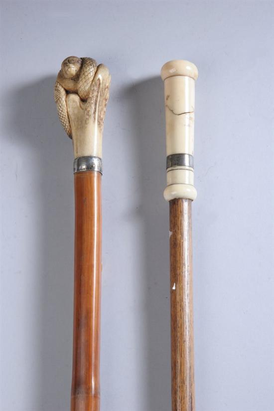 Appraisal: TWO CANES STAG-HANDLED MONKEY IVORY Stag handle carved with monkey