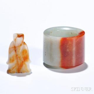 Appraisal: Jade Archer's Ring and a Figural Bead China the ring