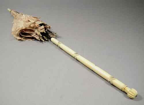 Appraisal: A Chinse ivory handled and hardwood parasol the handle modelled