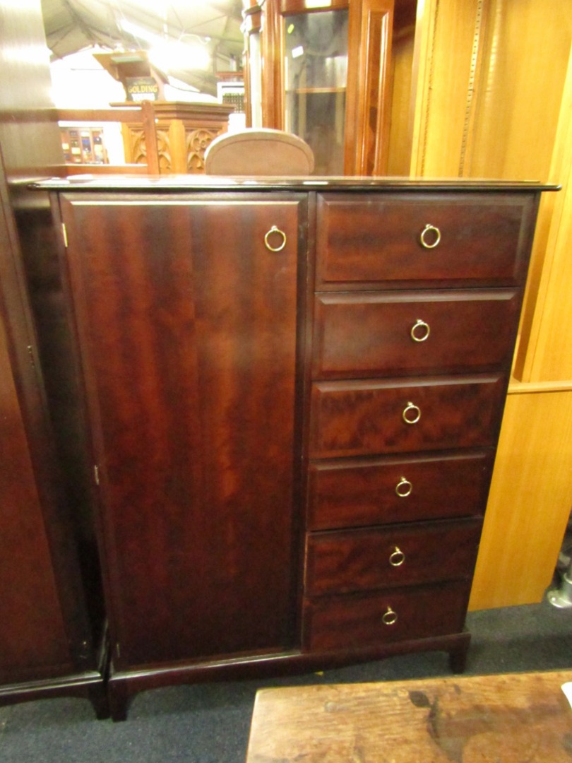 Appraisal: A Stag mahogany compactum wardrobe the hanging space flanked to