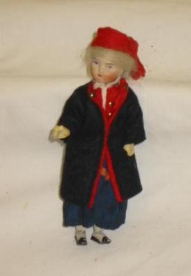 Appraisal: A bisque head dolls house doll with moulded and painted