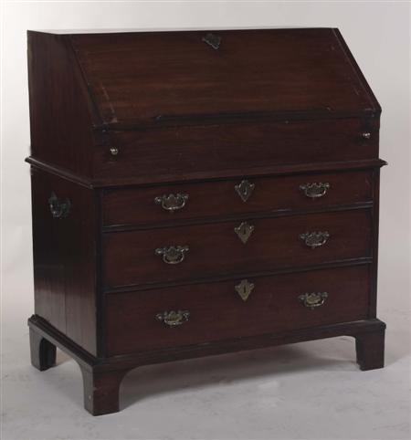 Appraisal: An early George III mahogany bureau the moulded fall-flap enclosing