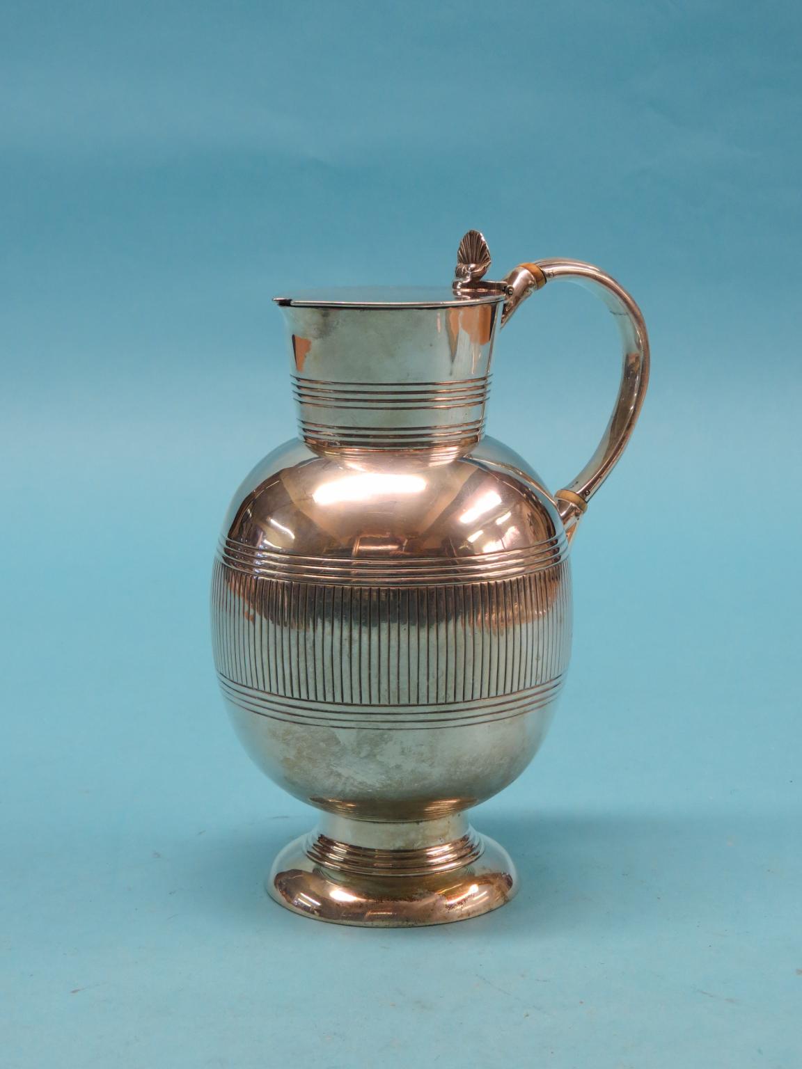 Appraisal: A Victorian silver wine ewer bulbous-shape with hinged cover and