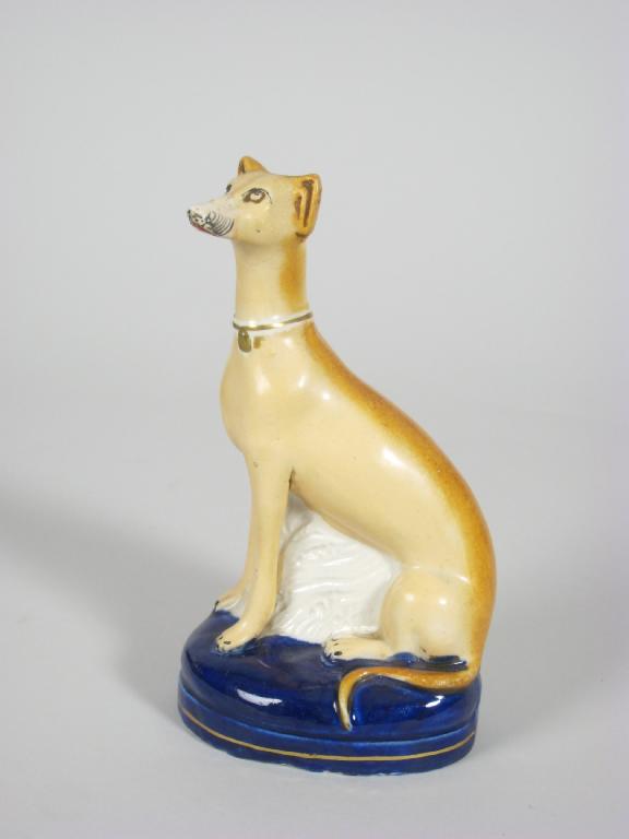 Appraisal: A Staffordshire seated Greyhound on cobalt blue base in H