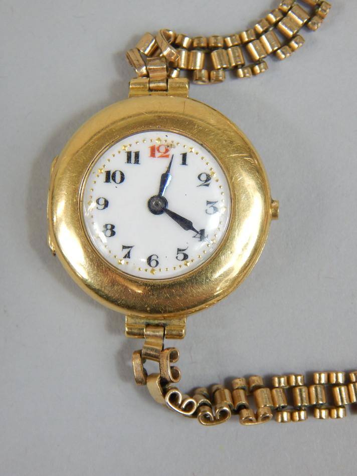 Appraisal: An ct gold ladies wristwatch the round white enamel dial