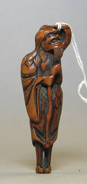 Appraisal: A carved wood netsuke of a sennin th Century Height