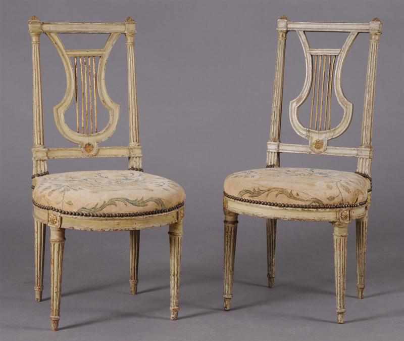 Appraisal: PAIR OF LOUIS XVI PAINTED AND PARCEL-GILT CHAISES LA REINE