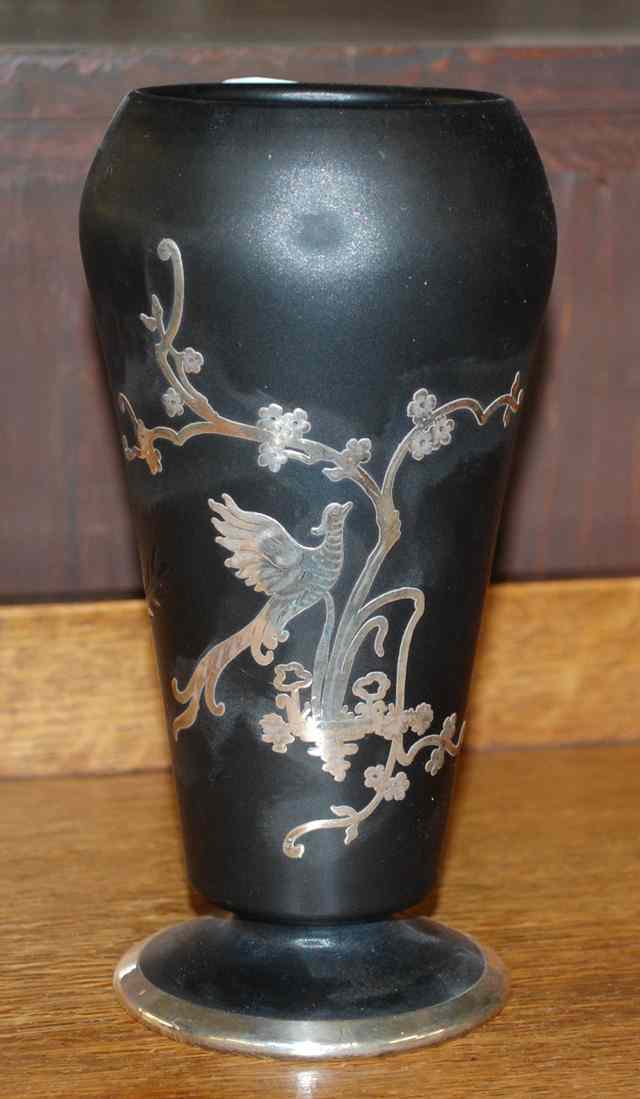 Appraisal: A TIFFIN BLACK SATIN OVERLAY PEDESTAL VASE with sterling silver