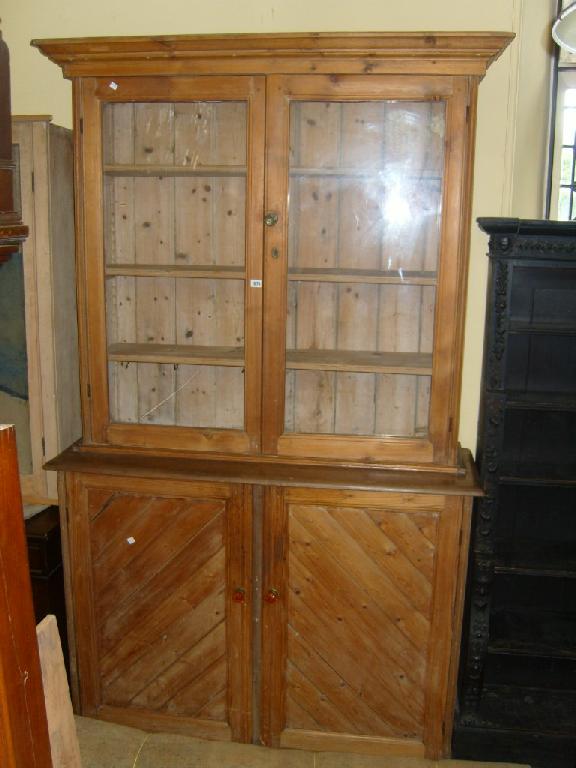 Appraisal: A Victorian pitch pine free standing schoolroom bookcase the lower