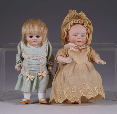 Appraisal: LOT OF TWO GERMAN ALL BISQUE DOLLS Wigged close-mouth stiff-neck