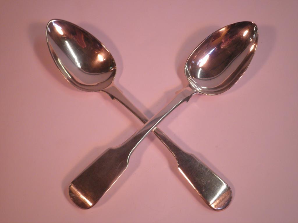 Appraisal: Two similar silver fiddle pattern serving spoons London hallmarks and