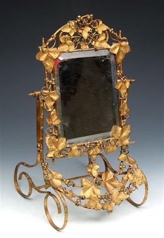 Appraisal: A TH CENTURY GILT METAL SWING DRESSING TABLE MIRROR on