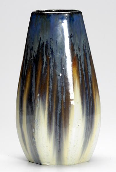 Appraisal: FULPER Faceted vase covered in blue to ivory flambe glaze