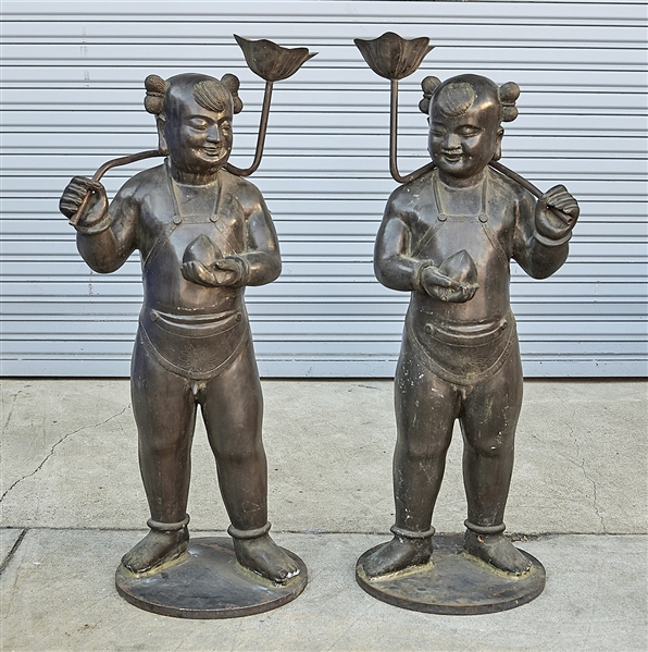 Appraisal: Pair of bronze child figure candle holders x each approx