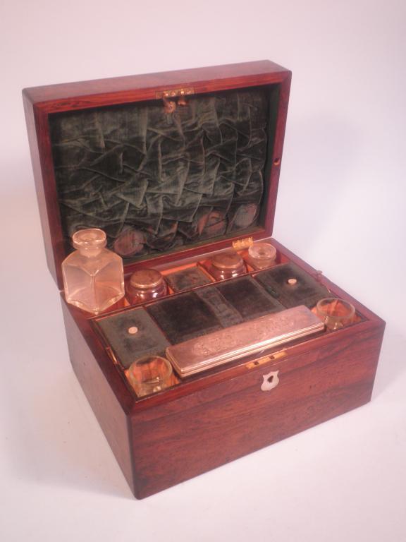 Appraisal: A Victorian rosewood dressing case the hinged lid with a