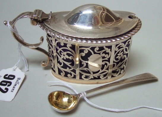 Appraisal: A silver oval hinge lidded mustard pot with floral and