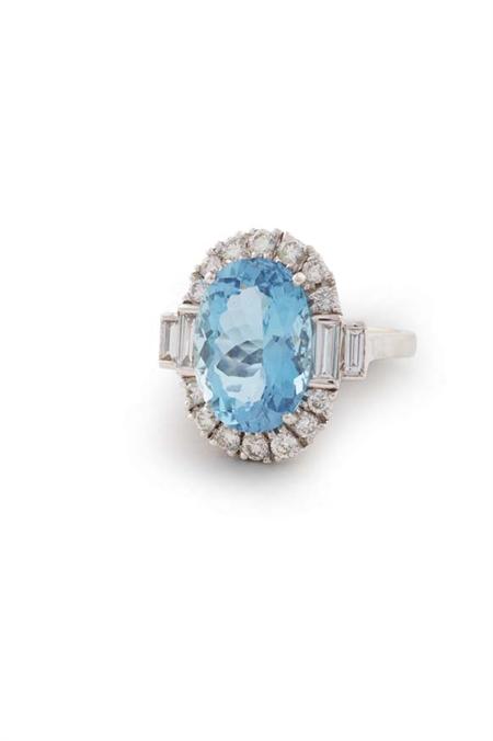 Appraisal: A modern aquamarine and diamond cluster ring claw set with