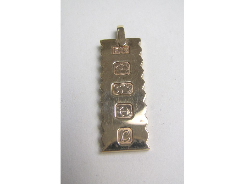 Appraisal: Nine carat gold ingot Approximately gms