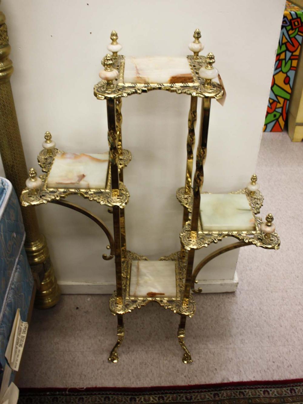 Appraisal: VICTORIAN STYLE BRASS AND ONYX FIVE-TIER ETAGERE each tier fitted