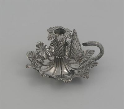 Appraisal: A Victorian small chamberstick with a border of leaves detachable