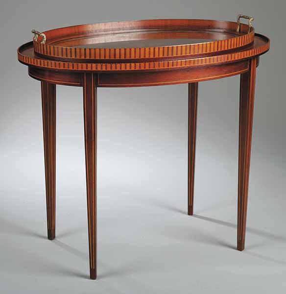 Appraisal: A Mahogany Inlaid Tray Table the oval tray top with