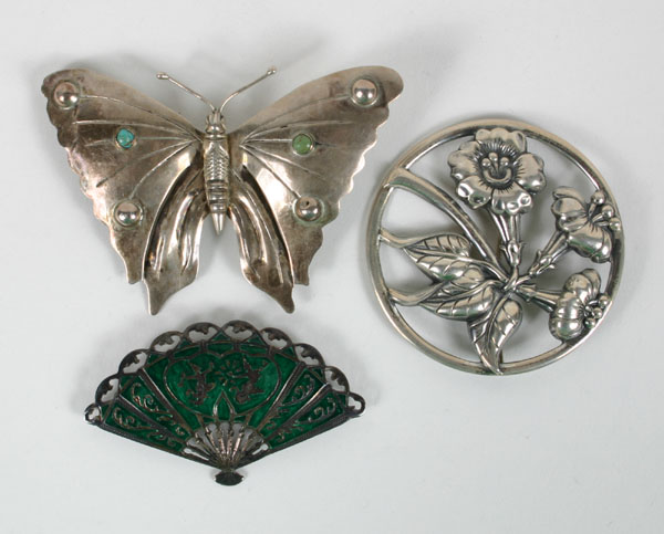 Appraisal: Three silver pins brooches including a sterling Danecraft floral Nouveau