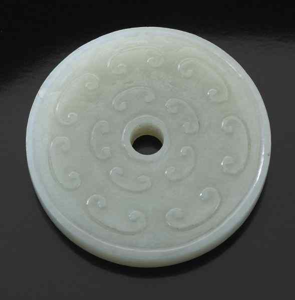 Appraisal: Chinese Ming carved jade bi-diskdepicting clouds and spots '' Dia