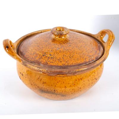 Appraisal: A th Century German casserole with lid orange speckled glaze