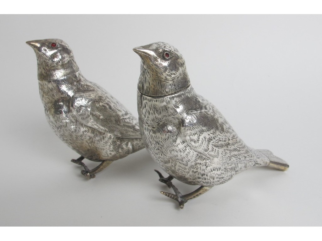 Appraisal: A pair of Continental silver castors modelled as birds each