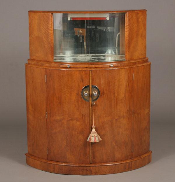 Appraisal: English Art Deco curved bar cabinet clear sliding doors above