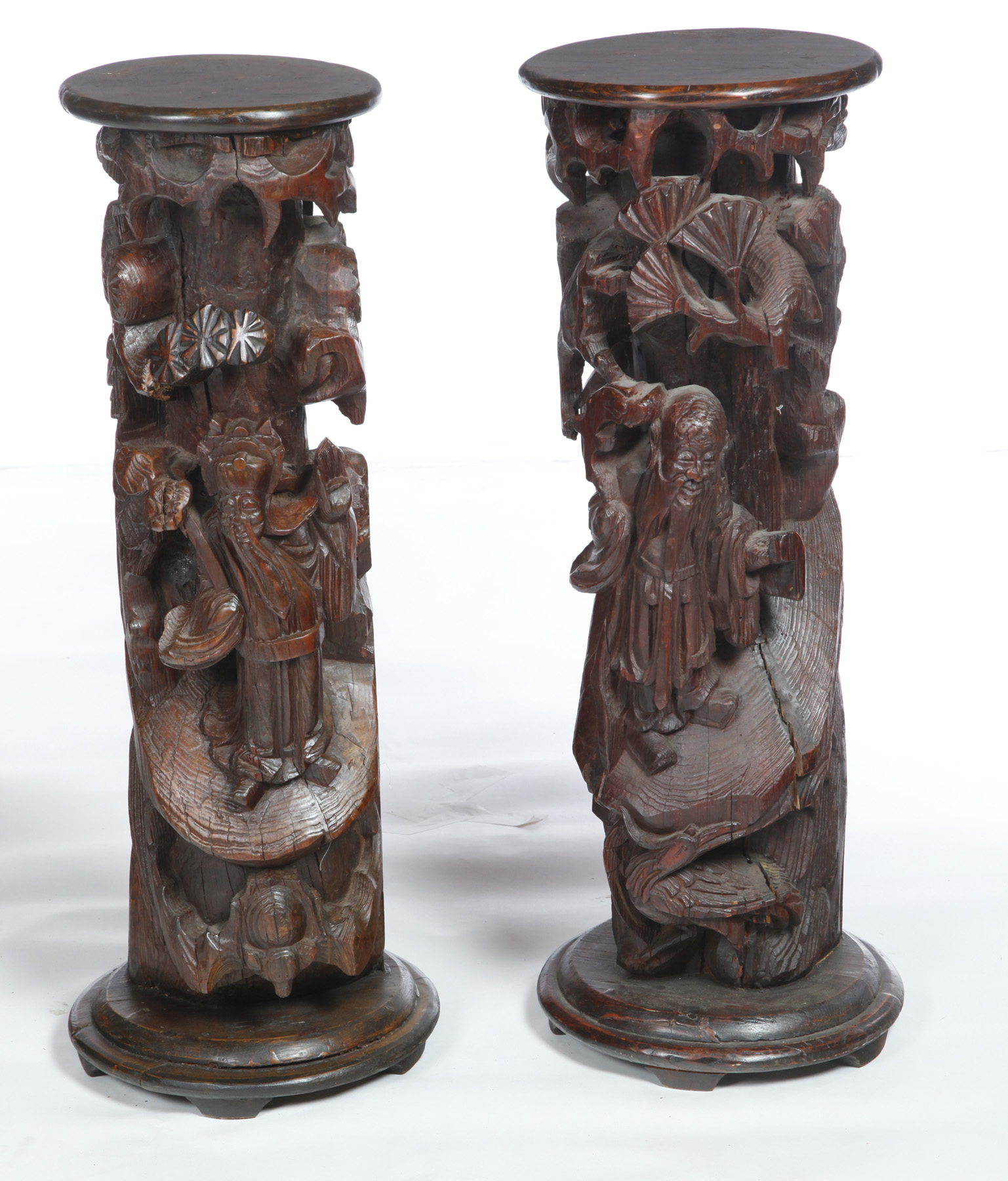 Appraisal: TWO CHINESE CARVED PEDESTALS Twentieth century hardwood People and pine