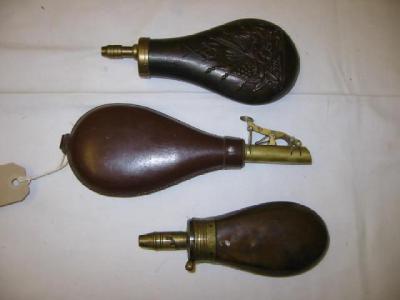 Appraisal: A COPPER POWDER FLASK with brass fittings and embossed with