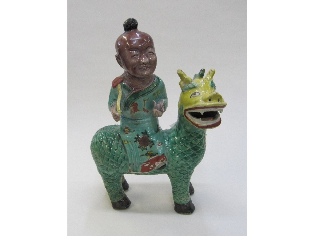 Appraisal: Chinese famille verte figure sat upon a dog of fo