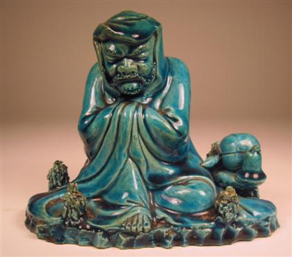 Appraisal: Chinese turquoise glazed porcelain figure of an arhat th century