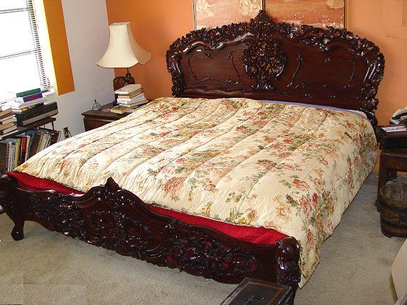 Appraisal: PROFUSELY CARVED KING SIZE MAHOGANY BED Headboard measures '' h