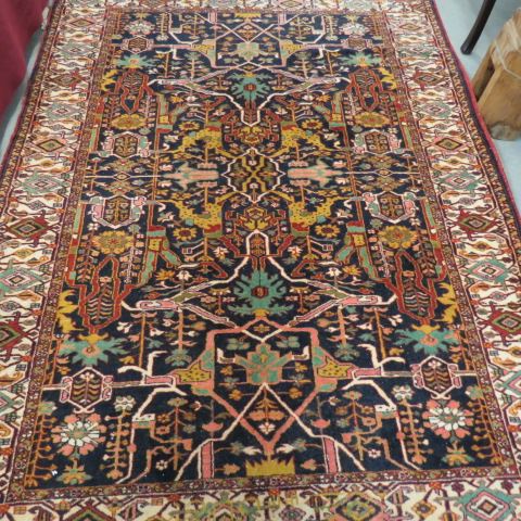 Appraisal: Silk Persian Handmade Rug elaborate designs indigio field ivory border