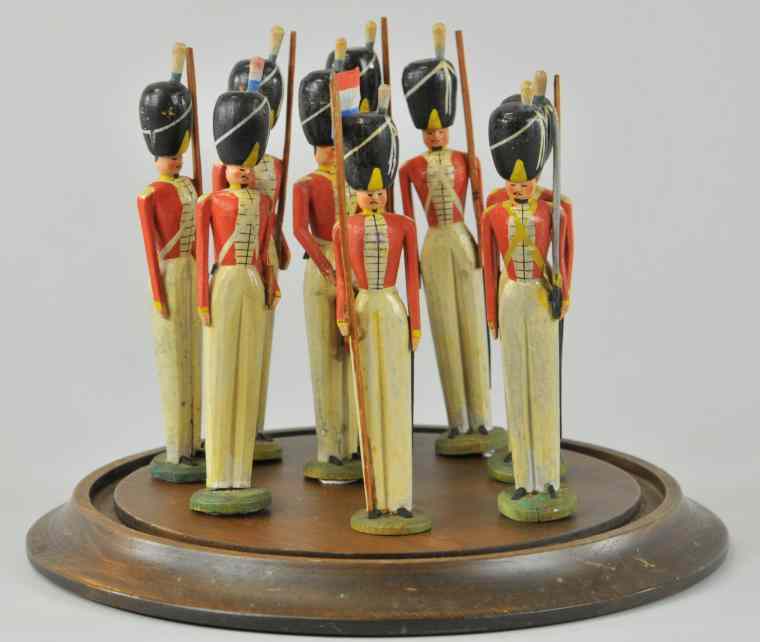 Appraisal: CARVED ENGLISH GUARD SET Each hand painted and carved in