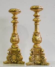 Appraisal: A pair of Italianate gilded candlesticks