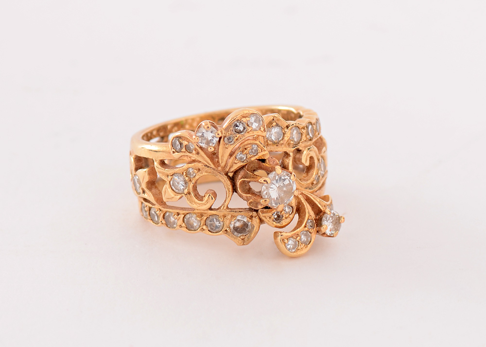 Appraisal: UNUSUAL GOLD FILIGREE DIAMOND RING K yellow gold scrolling filigree