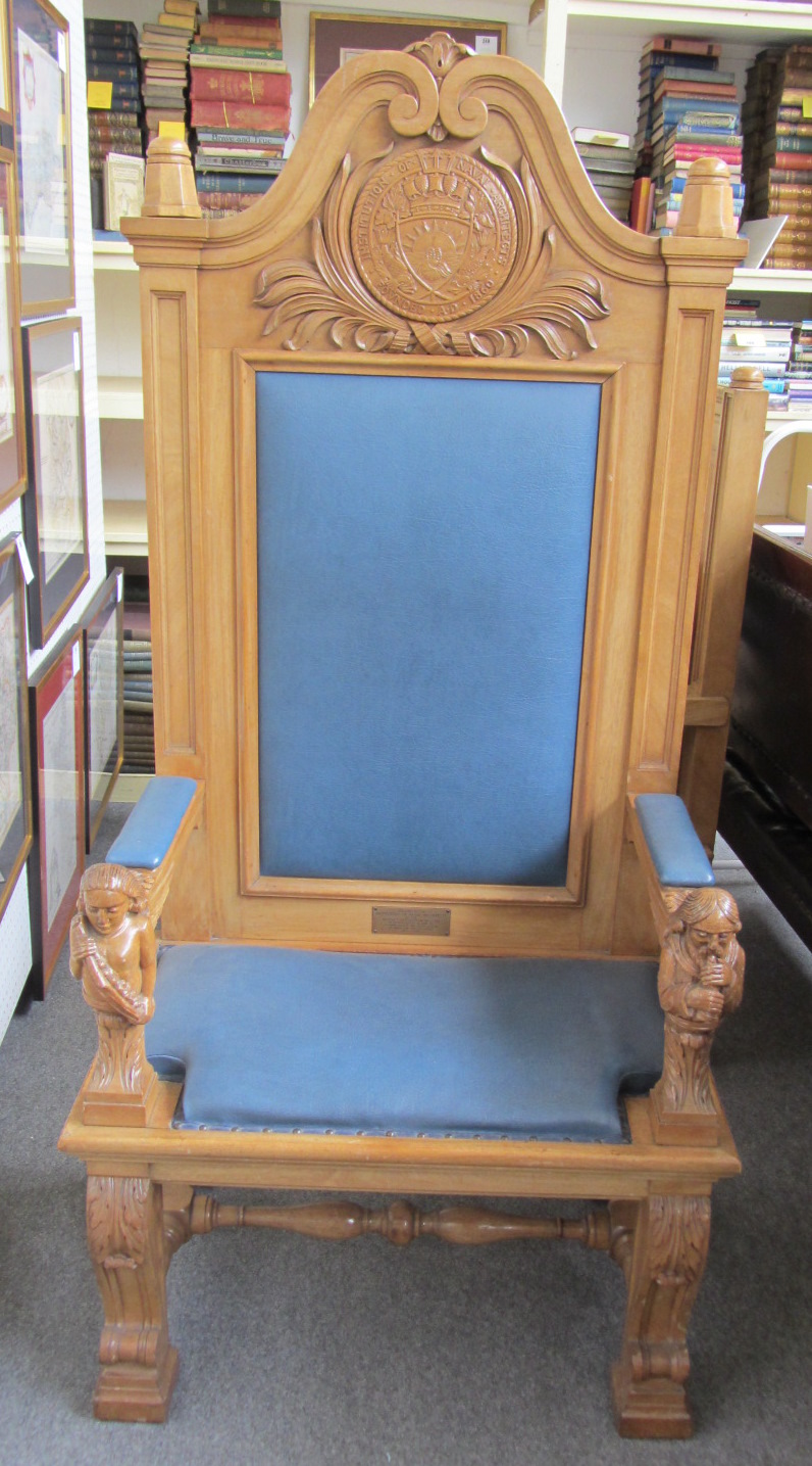 Appraisal: A th century walnut high back throne chair with carved