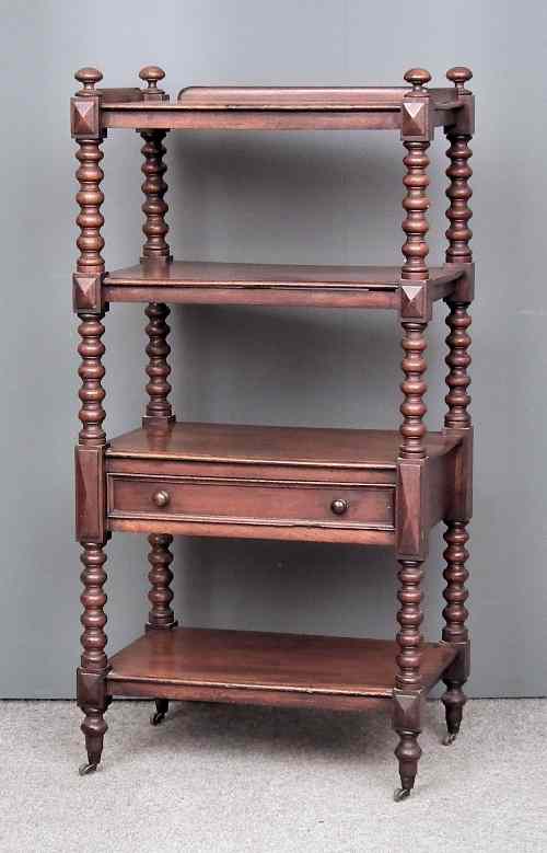 Appraisal: A Victorian mahogany four tier tray top whatnot fitted single