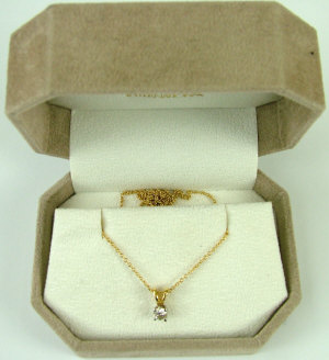 Appraisal: An ct gold solitaire diamond pendant The brilliant cut diamond