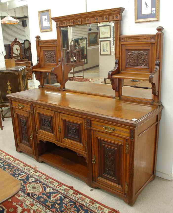 Appraisal: LARGE CARVED OAK SIDEBOARD English late th century the top