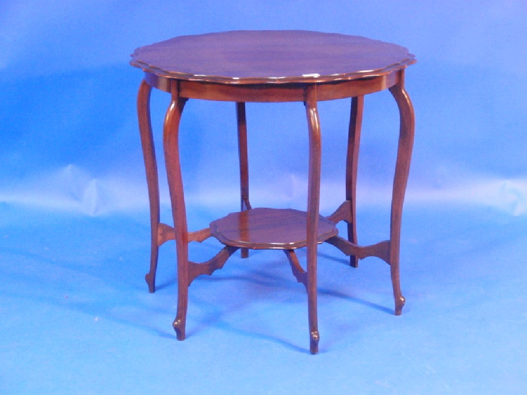 Appraisal: A Victorian walnut window table with moulded top cabriole legs