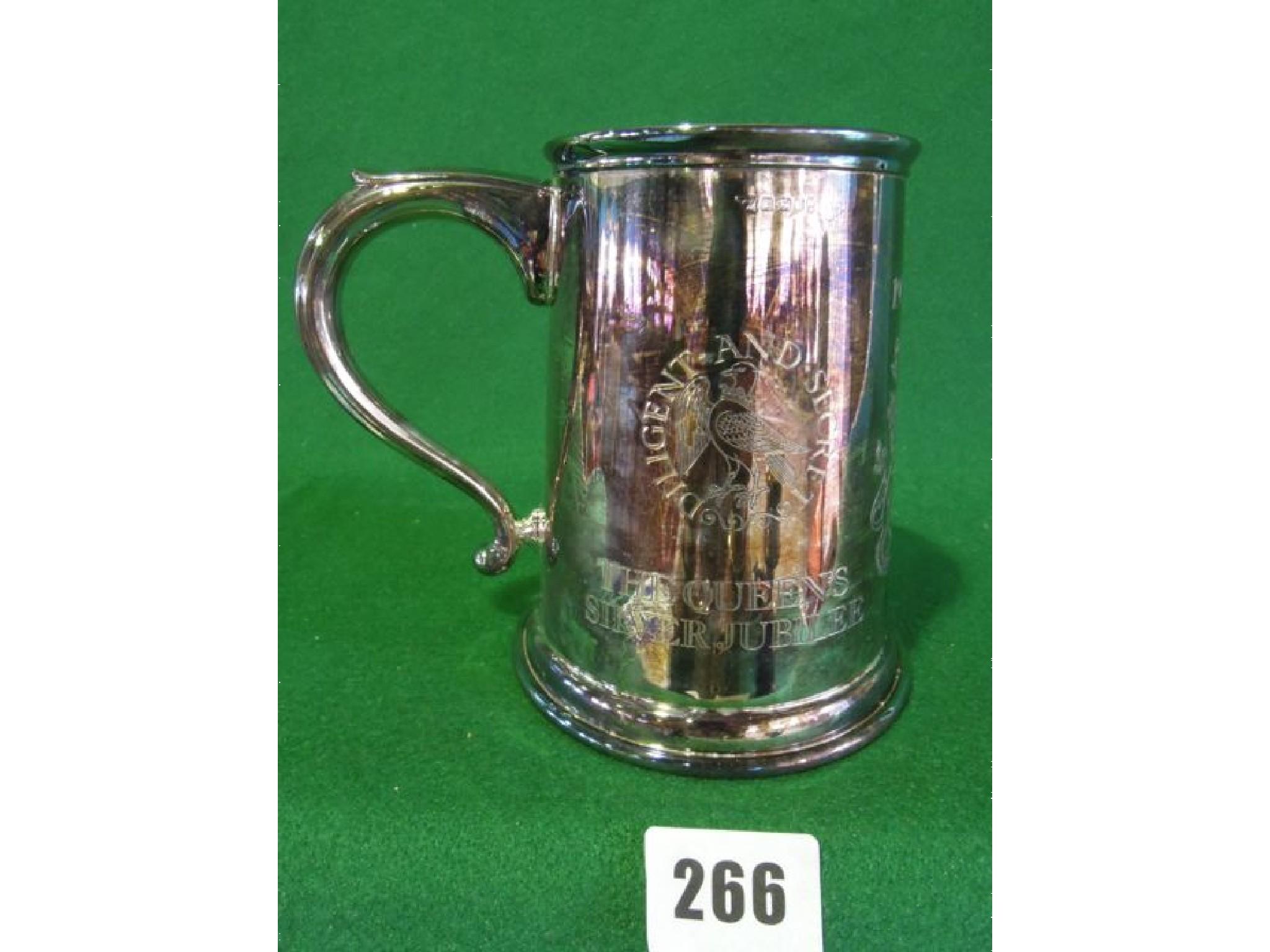 Appraisal: A Georgian style silver mug with engraved coat of arms