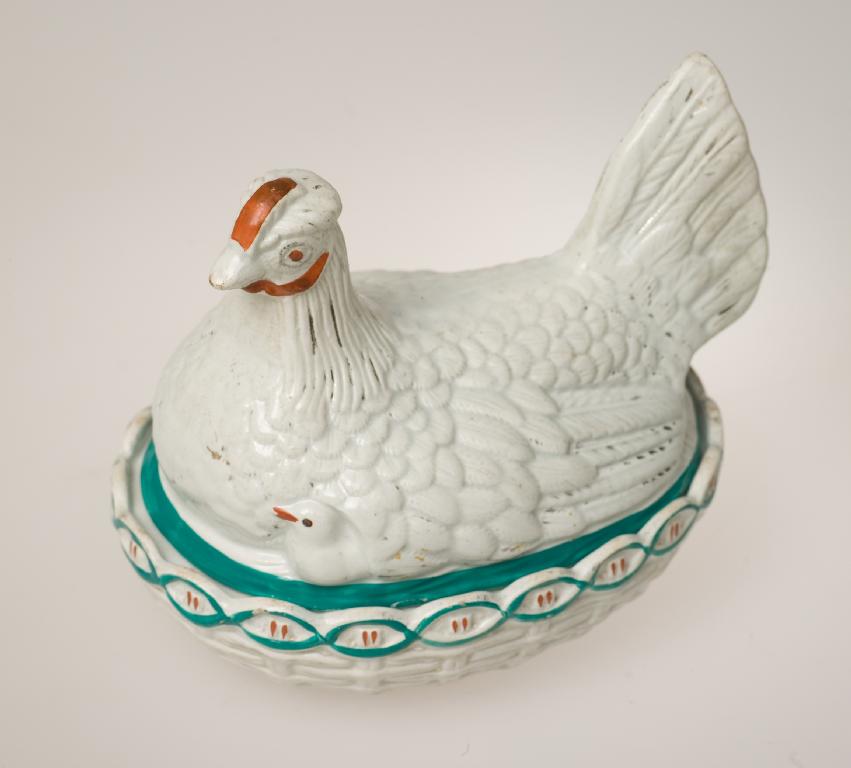 Appraisal: STAFFORDSHIRE HEN EGG BASKET mid- th century with a pearlescent