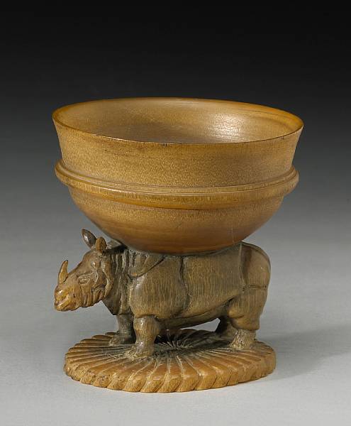 Appraisal: A carved rhino horn cup India dated by inscription to