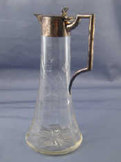 Appraisal: A sterling silver mounted claret jug the broad star cut