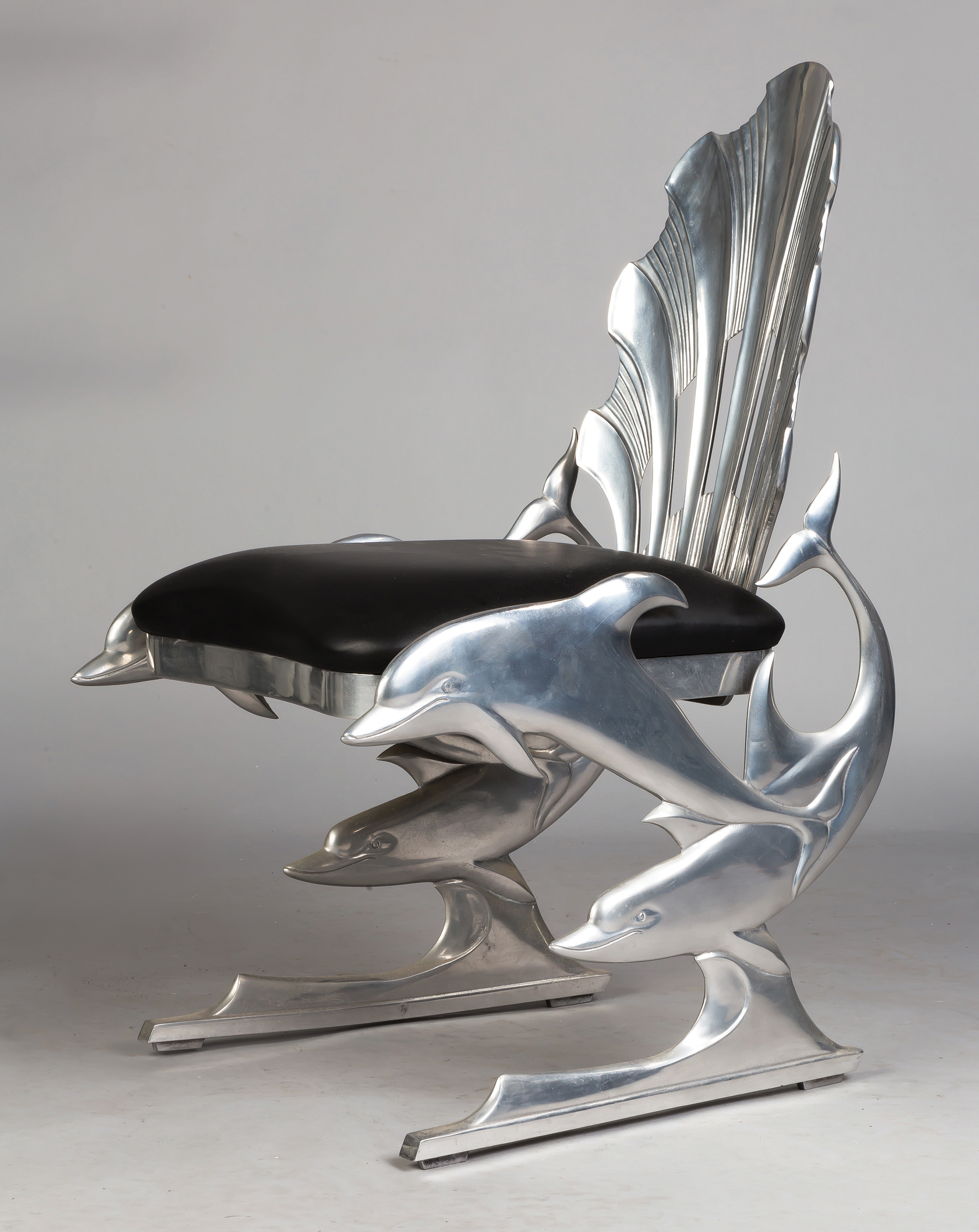 Appraisal: Ray Lewis Pair of Cast Aluminum Dolphin Chairs of Leather