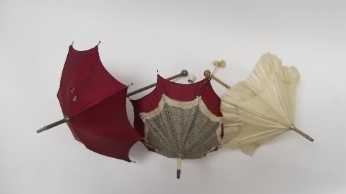 Appraisal: A doll's floral parasol with crimson border and simulated ivory